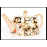 A 19th century Victorian Davenport China Imari pattern teapot of angular form being marked to the