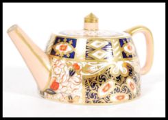 A 19th century Victorian Davenport China Imari pattern teapot of angular form being marked to the