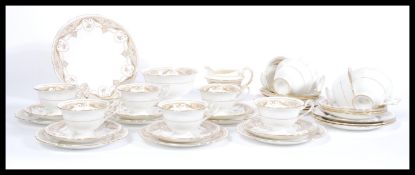 An early 20th Century Shelley 1910 - 1916 late Foley tea service consisting of cups saucers side