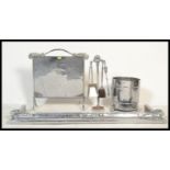 A 1930's Art Deco chrome fireside suite comprising fire fenderkerb, coal bucket,  fire screen and