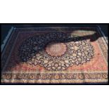 A Persian Islamic blue ground Keshan rug with flor