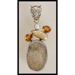 A stamped 925 silver pendant set with a citrines, pearls and a grey crystal stone. Weight 22.8g.