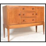 A mid century Cotswold School walnut sideboard Credenza by Arthur Reynolds, Ludlow having tapering