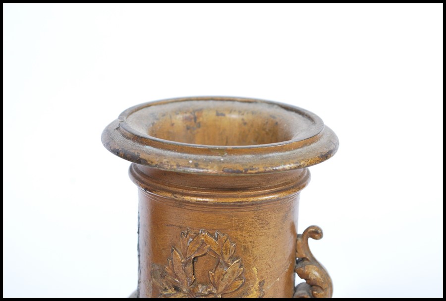 A pair of 19th century bronze urns raised on square bases with decorations of swags and ribbons with - Image 3 of 9
