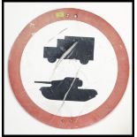 A vintage 1960's road sign from Salisbury Plain warning of tanks and military trucks crossing.