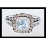 A hallmarked 14ct white gold, diamond and aquamarine ring, branded Le Vian, set with a cushion cut