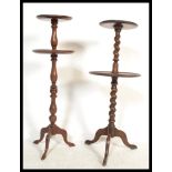 A Victorian mahogany barleytwist dumb waiter with twin circular tiers being raised on splayed feet