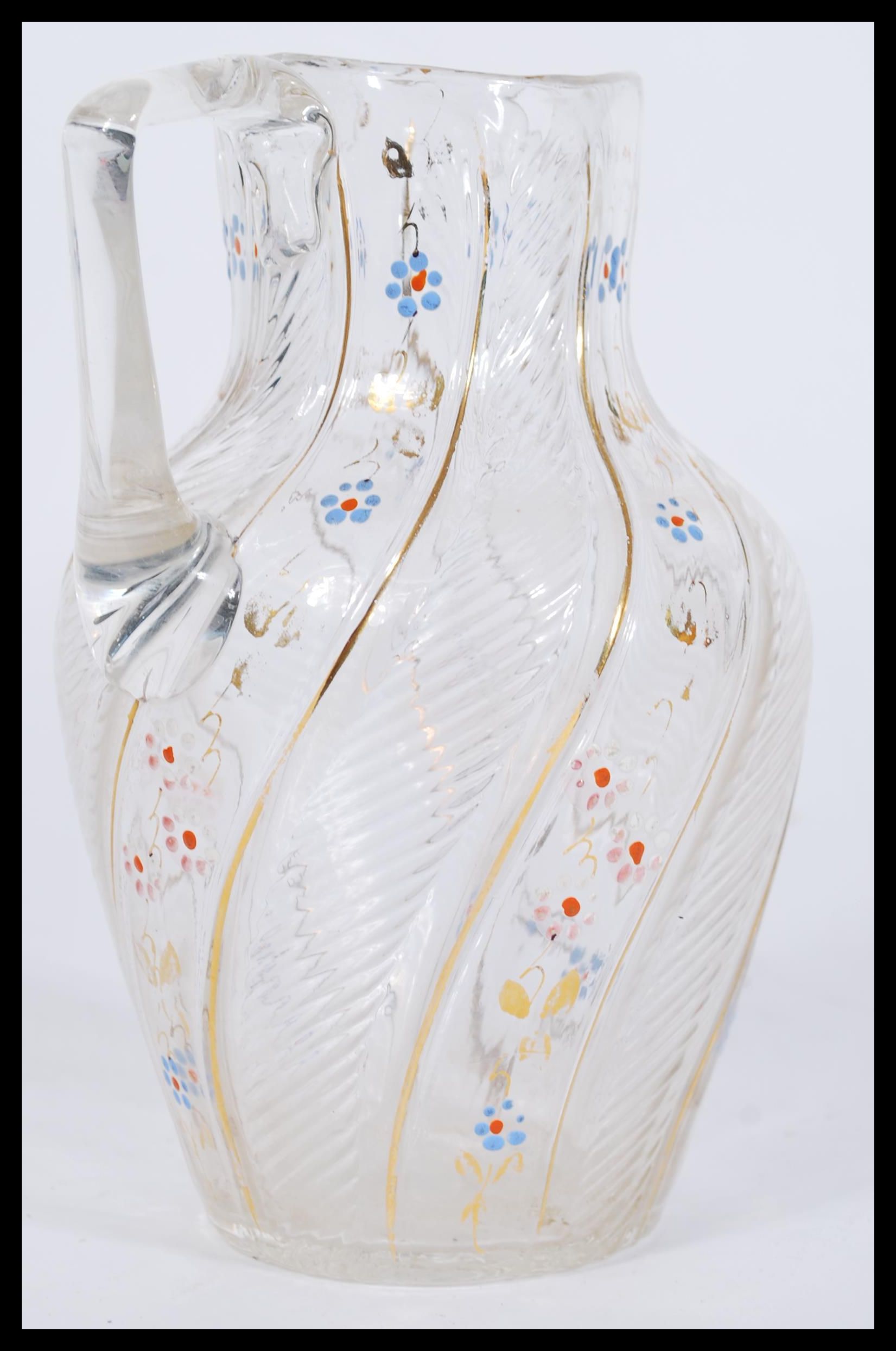 A 19th century Victorian Bohemian style glass jug having hand painted floral decoration with gilt - Image 2 of 4