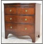 A Georgian revival early 20th century mahogany serpentine fronted bachelors chest of drawers.