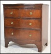 A Georgian revival early 20th century mahogany serpentine fronted bachelors chest of drawers.