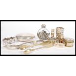 A collection of silver and silver white metal items to include scent phials, small scent funnels,