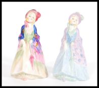 Two variations of the Royal Doulton Figurine Paisley Shawl m3 and m4 with hand painted and printed