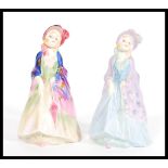 Two variations of the Royal Doulton Figurine Paisley Shawl m3 and m4 with hand painted and printed