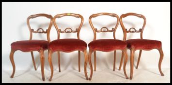 A set of 4 good 19th century Victorian mahogany balloon back dining chairs having red velour
