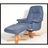 A Stressless style blue leather reclining armchair and matching ottoman raised on a faux wood base