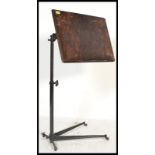 A stunning early 20th Century Edwardian cast metal reading lectern , the stained adjustable pine top