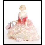 A vintage early 20th Century Royal Doulton ceramic figurine entitled Tildy, HN1575. Stamped to base.