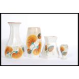 A collection of E Radford 1930's Art Deco ceramics in ' Wood's ' pattern. To include a tall vase,