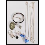 A selection of silver jewellery to include a stamped 925 silver necklace with a heart shaped glass