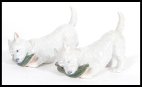 A pair of Royal Copenhagen ceramic dog figurines depicting west highland terrier and slipper model