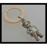 A 19th Century Victorian silver plate childs rattle in the form of a boy in a top hat and tails