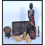 A selection of treen items to include to carved tree roots in the form of monkeys and another in the