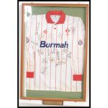A framed, glazed and mounted oversized commemorative football top for Swindon Town Football Club,