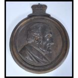 A mid 19th Century Victorian gilt bronze plaque depicting the bust of The Duke of Wellington in
