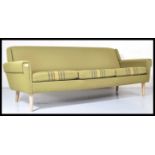 A mid 20th century retro vintage Scandinavian three seat sofa settee having an angular and winged