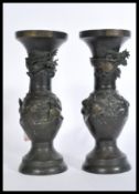 A pair of 20th century Chinese bronze vases raised