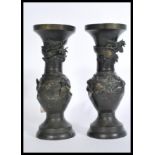 A pair of 20th century Chinese bronze vases raised