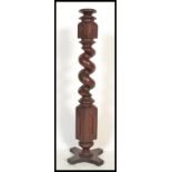 A 19th Century Victorian Mahogany barleytwist torchere plant jardiniere stand raised on plinth