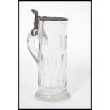 A 19th century Georgian faceted glass stein tankard having a tall faceted body with pewter mounts