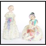 Two ceramic figurines by Royal Doulton HN 1434 ' The Bridesmaid ' and  ' Monica ' - HN 1458, both