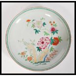 A believed 17th Century Chinese porcelain charger plate having hand painted enamel decoration of