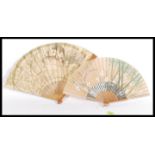 Two vintage early 20th century fine hand fans to include a French example with depicting a maiden