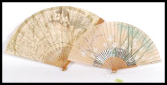 Two vintage early 20th century fine hand fans to include a French example with depicting a maiden