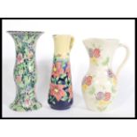 A group of vintage 20th century jugs to include an Old Tupton Ware tall jug of cylindrical