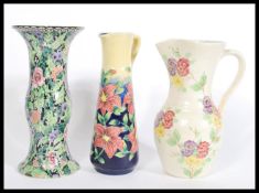 A group of vintage 20th century jugs to include an Old Tupton Ware tall jug of cylindrical