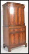 A Bevan and Funnell Reprodux  flame mahogany four door bow fronted cocktail / drinks cabinet.
