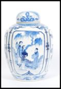 A large 19th century blue and white Chinese ginger jar with hand painted cartouche panels