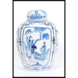 A large 19th century blue and white Chinese ginger jar with hand painted cartouche panels