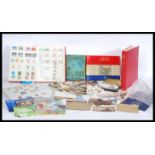 A large quantity of mixed stamps to include an album of Great Britain commemorative stamps,
