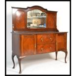 A 1920's flame mahogany mirror back sideboard. Raised on squared legs  supporting a  sideboard