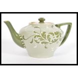 A 19th Century Victorian early Moorcroft James Macintyre Faience ware teapot having tubelined