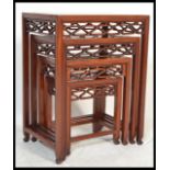 A 20th century Oriental Chinese hardwood quartetto nest of four graduating tables.The rectangular