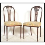 A pair of early 20th Century Edwardian mahogany dining / bedroom chairs in the manner of