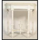 A Victorian 19th century white painted marble top console table. Raised on reeded tapering legs with