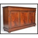 A good Victorian style mahogany sideboard being raised on a plinth base with bun feet having a