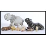 A collection of African carved soapstone figurines